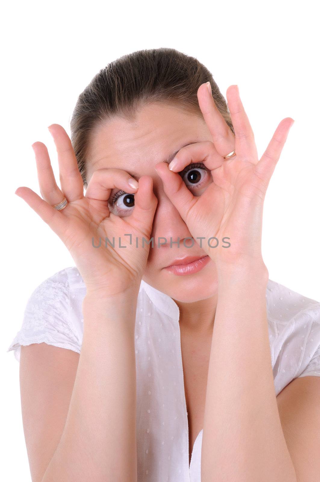 Funny young woman imitate loking through binocular. Isolated on white background.