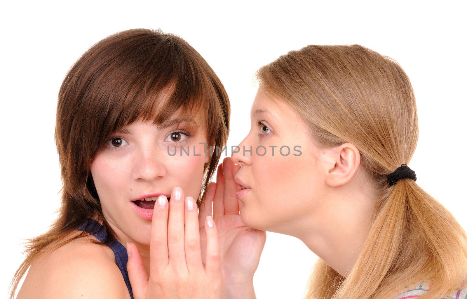 One young woman tell surprise news to another girl on white background