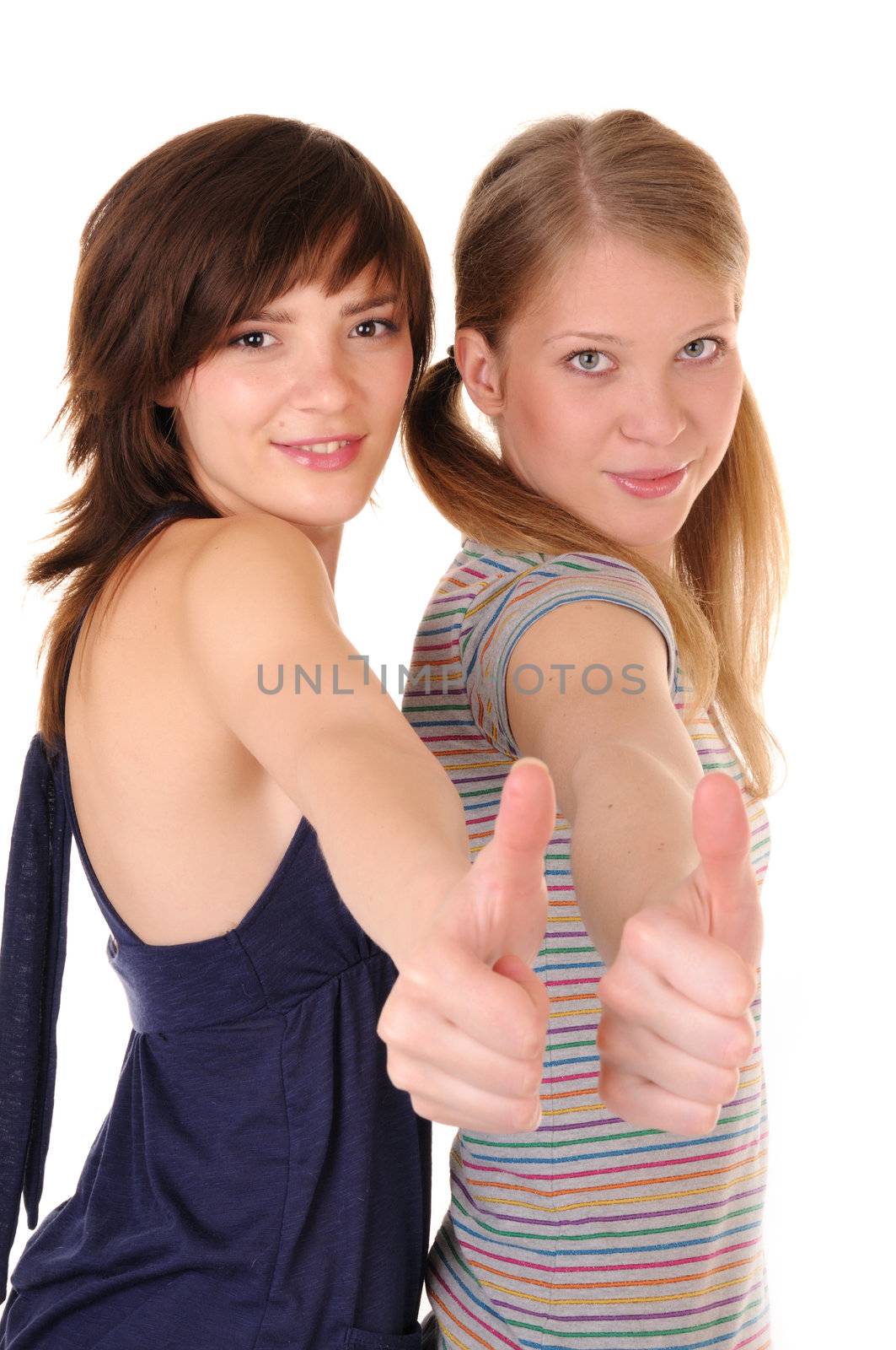 Two smilling girls are showing allright on white background