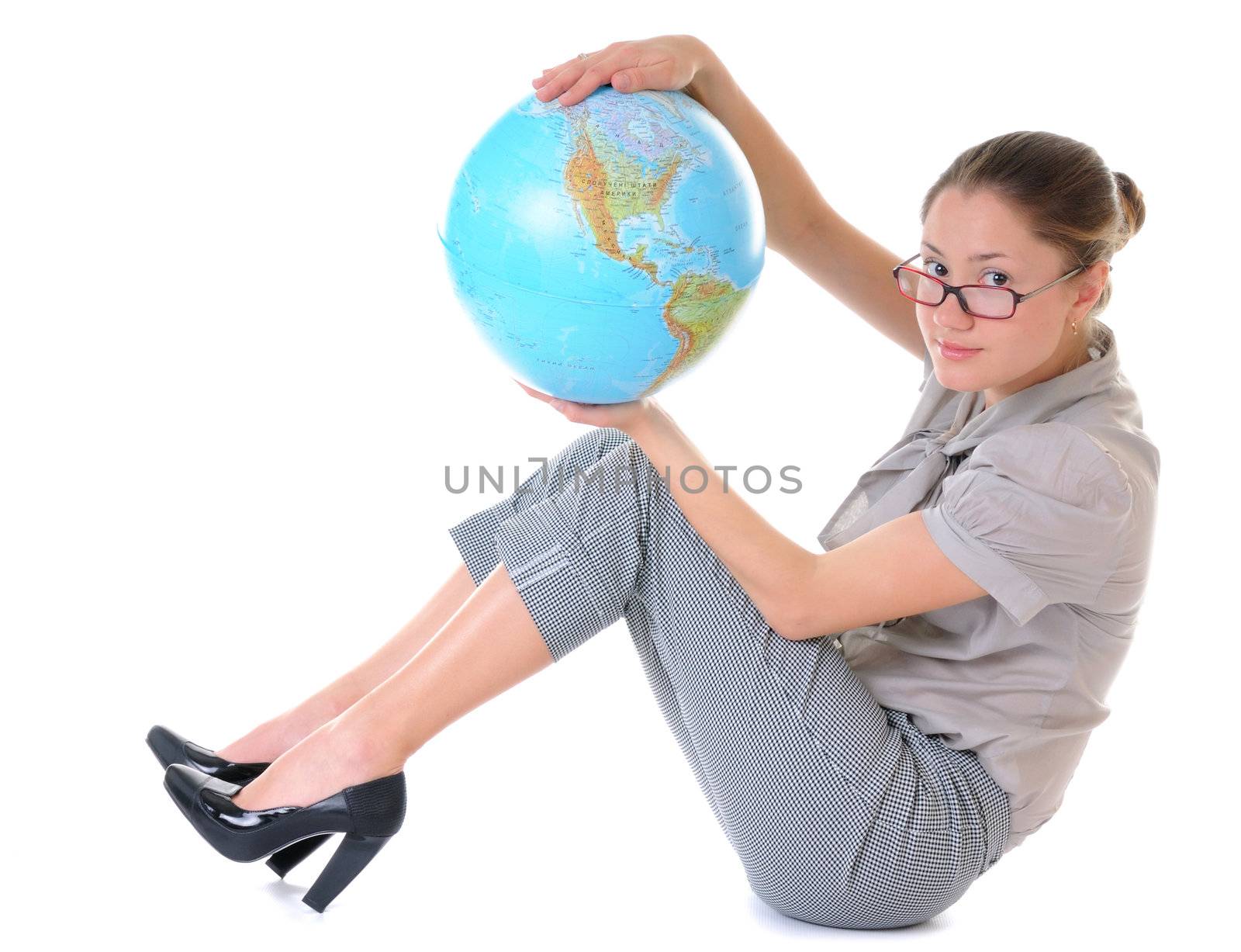 Beauty woman in glasses is sitting with a globe in hands