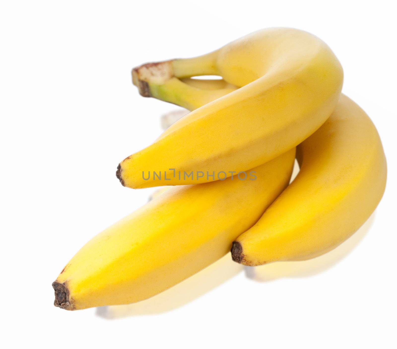 Bunch of fresh bananas with soft reflection isolated on white background. Shallow of depth.