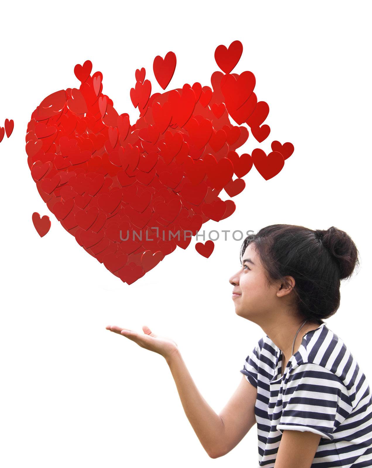 Romantic young woman holding a big heart composed of small red hearts in hands