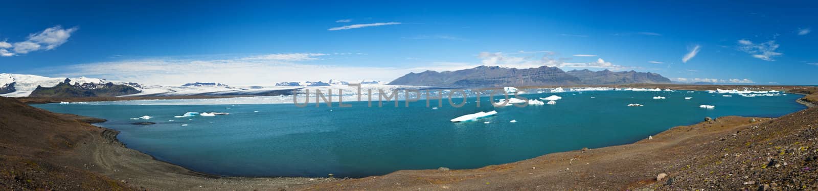 Beautiful panoramic photo of Jokulsarlon Glacial lake full of floating icebergs