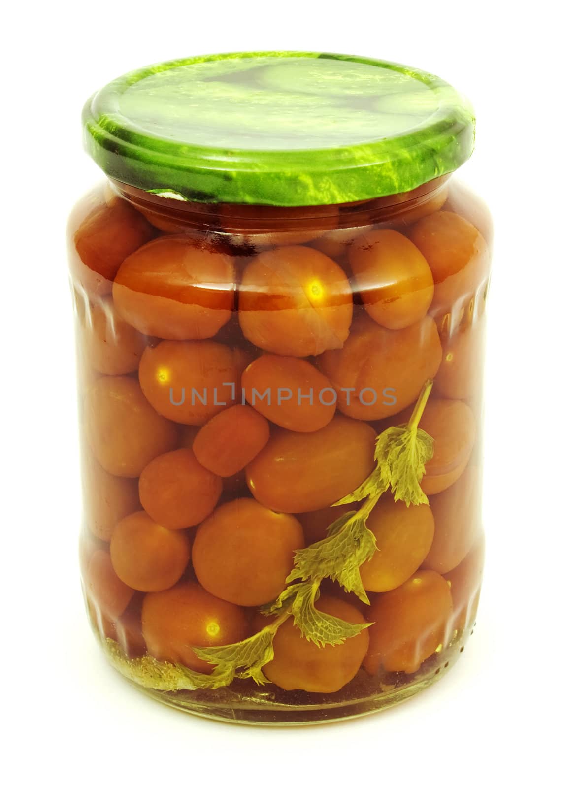 Marinaded tomatoes-babies with mint in a glass jar
