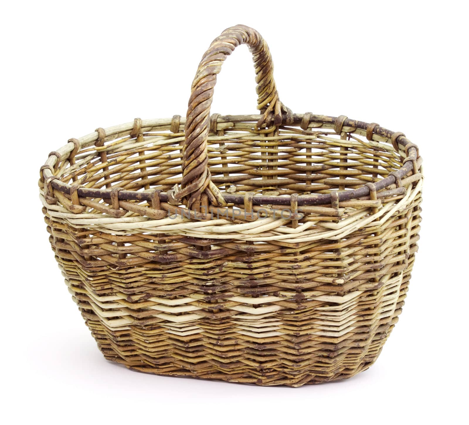 Basket in wattled from willow rods in white background