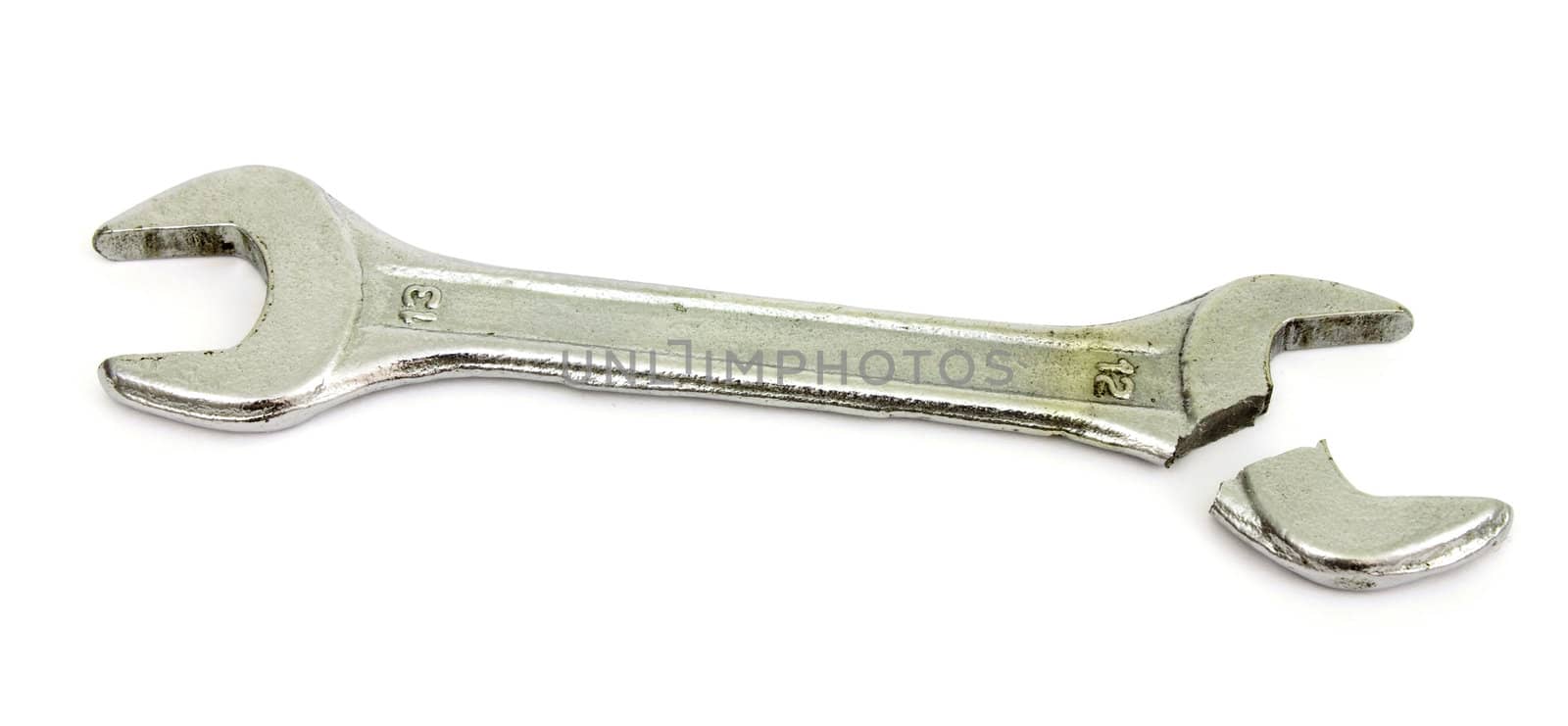 One broken wrench lies on  white background