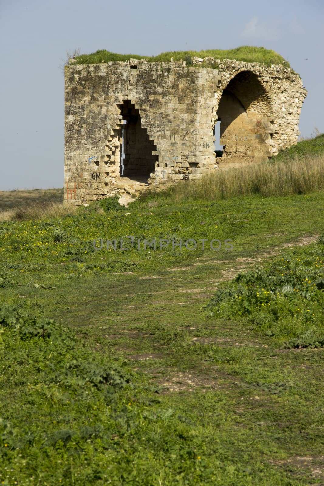 Old abandoned standing alone ruined house