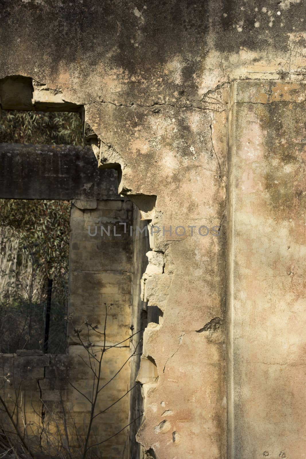 Old abandoned standing alone ruined house