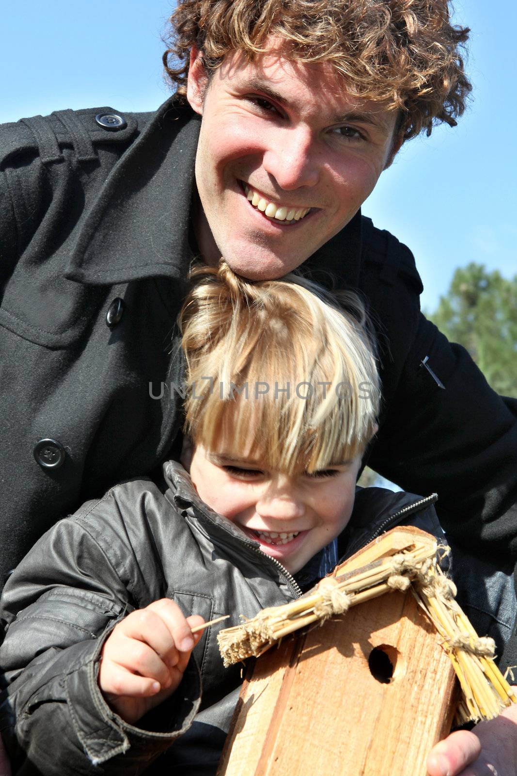 Portrait of happy man with boy