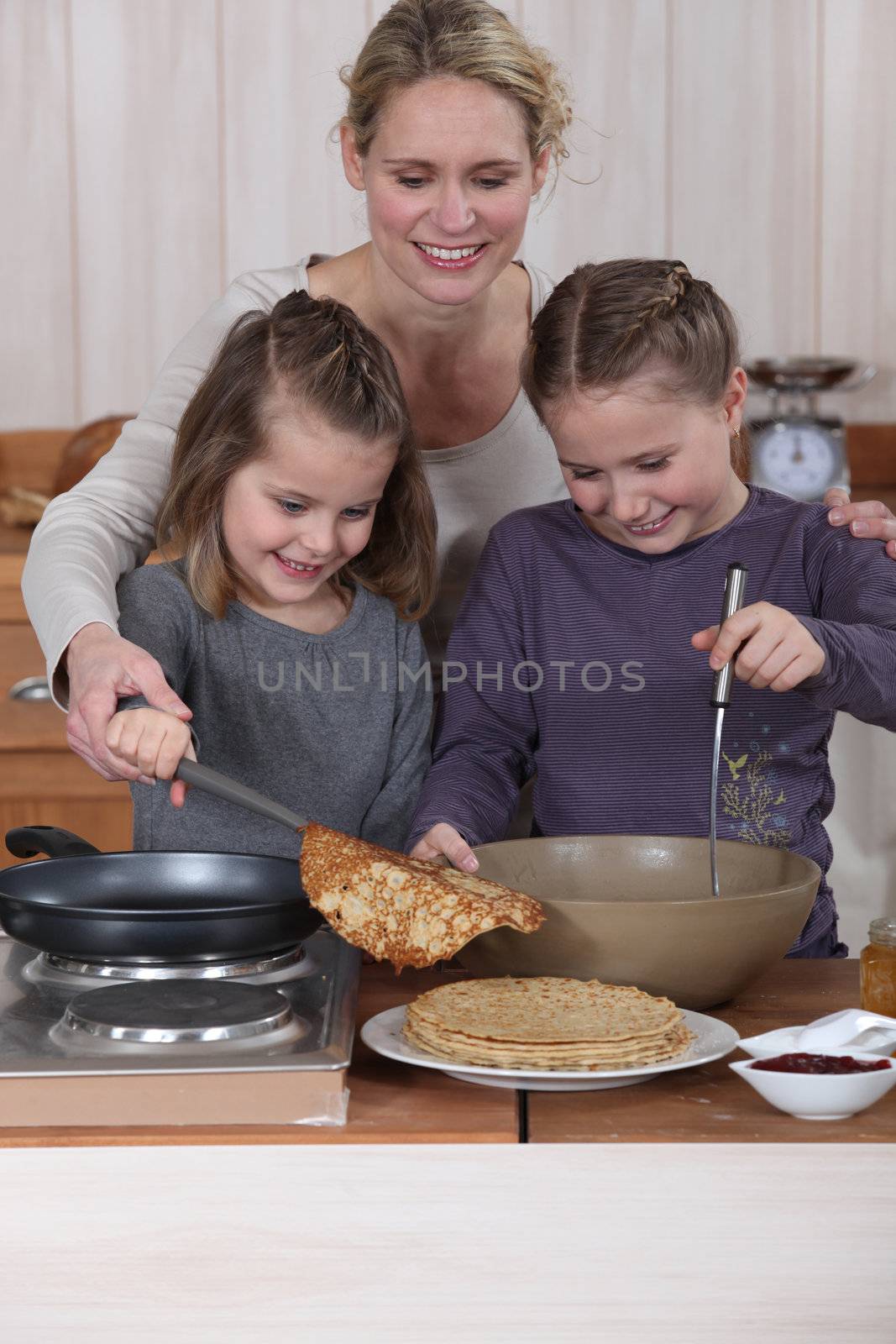 Family cooking pancakes