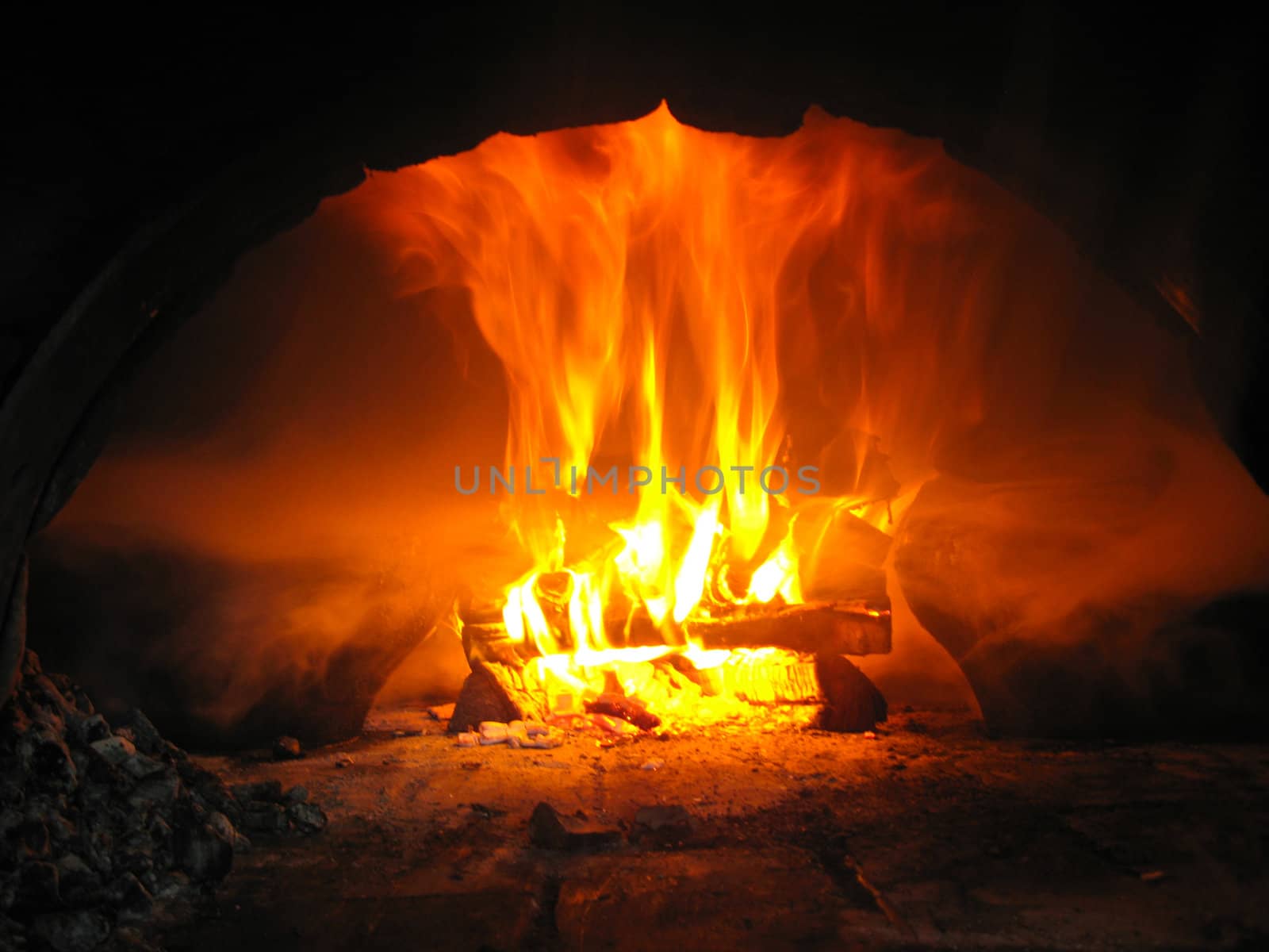 Fire wood brighly burning in the furnace