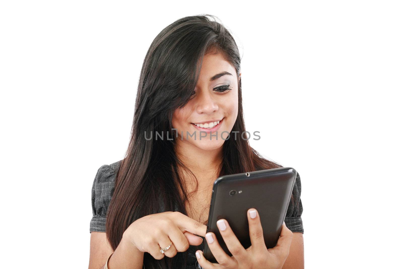 Woman holding tablet computer isolated on white background. working on touching screen. Casual smiling caucasian hispanic woman.