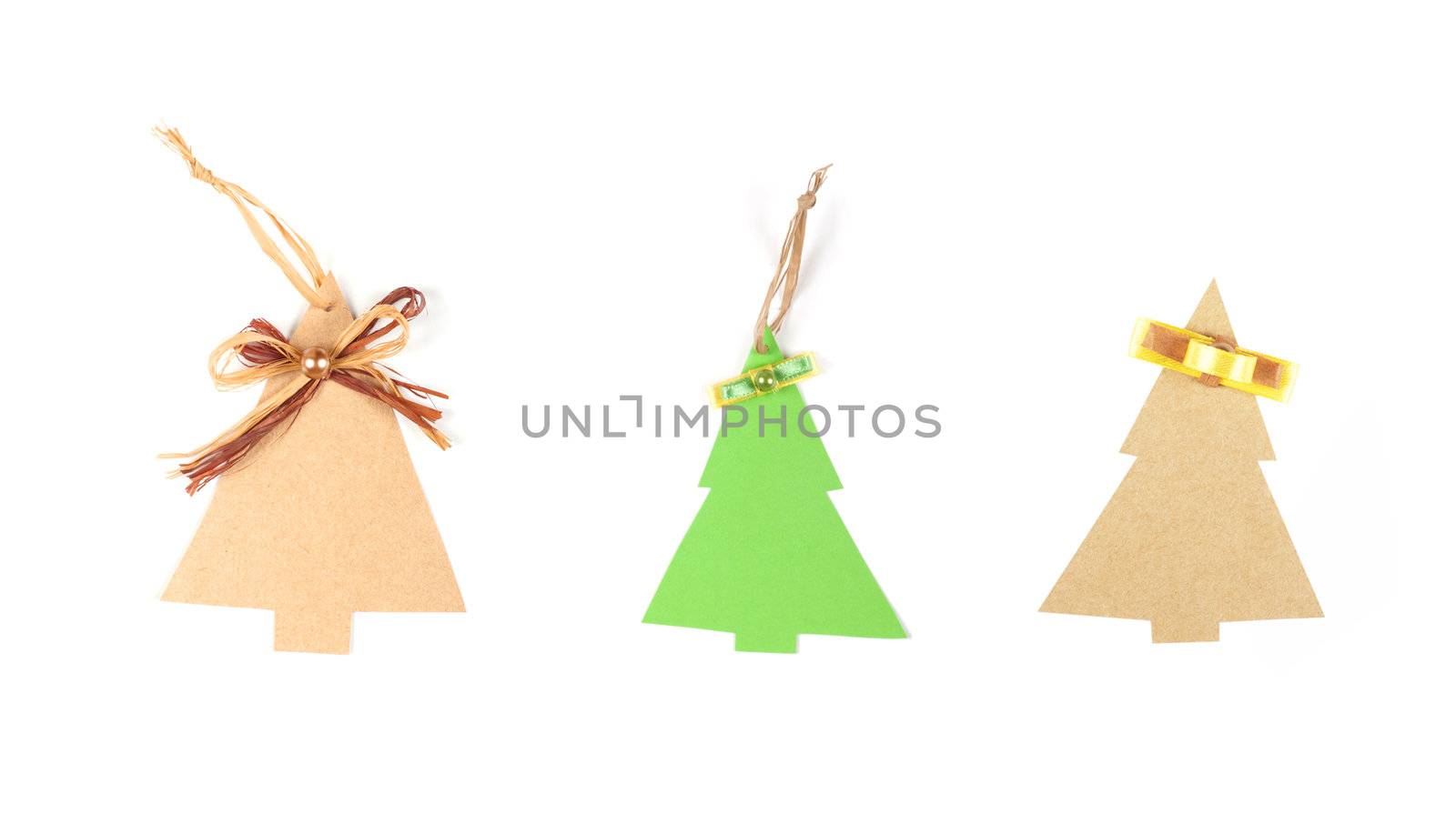 Three christmas tree made of old paper with a small bow and space for Your text