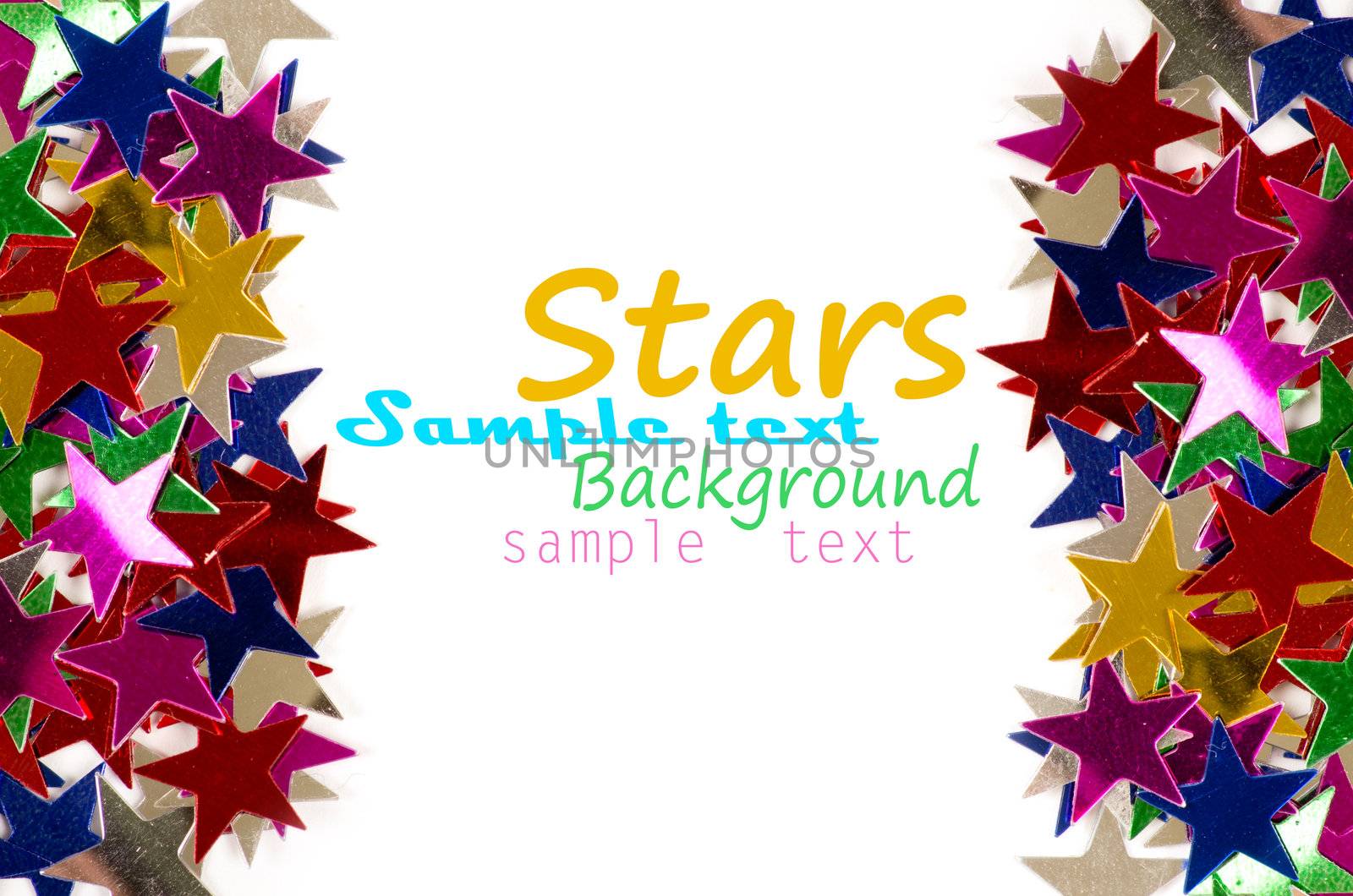 Christmas decoration of colored confetti stars against white background