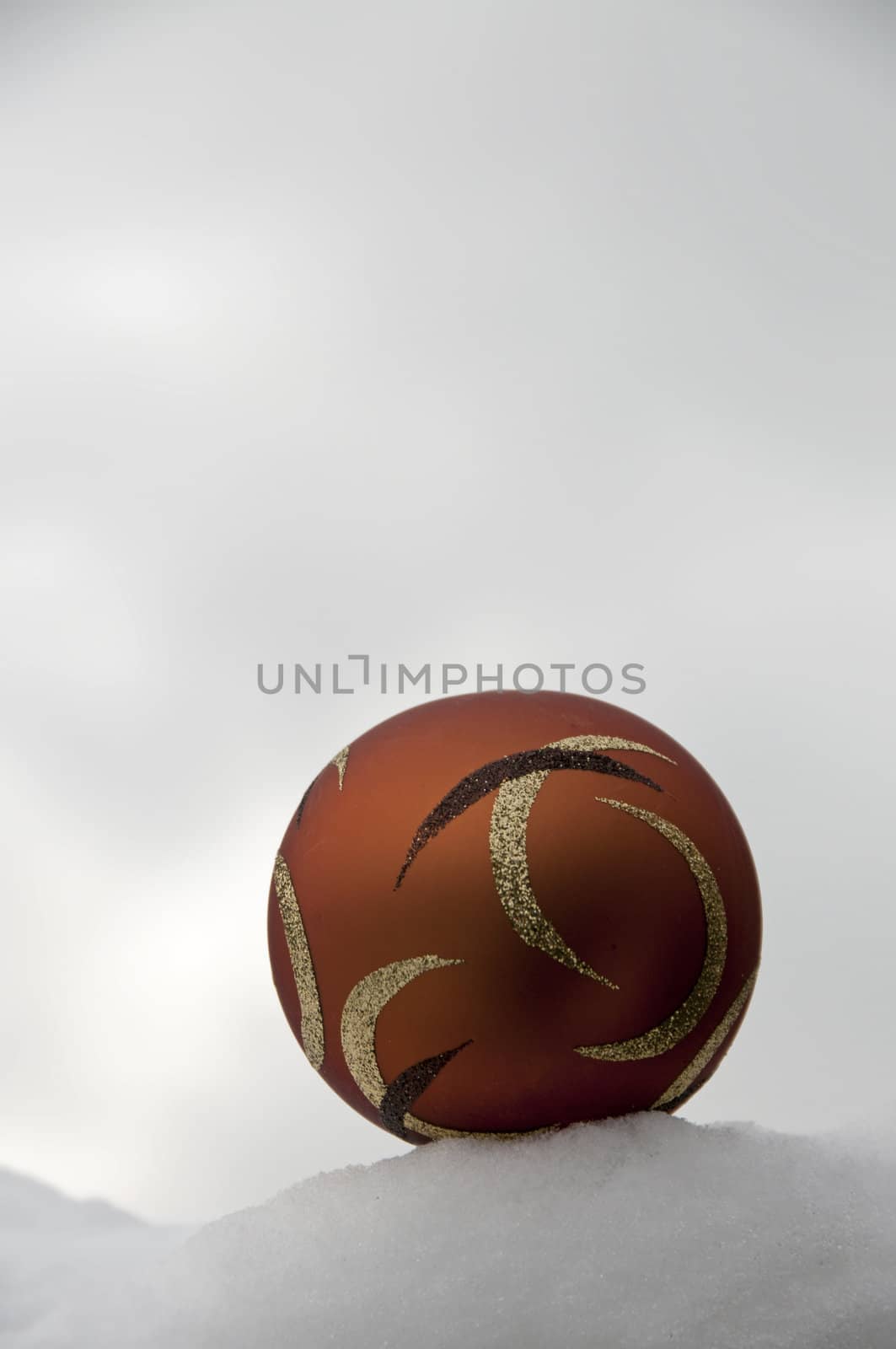christmas decoration ball in white snow in winter