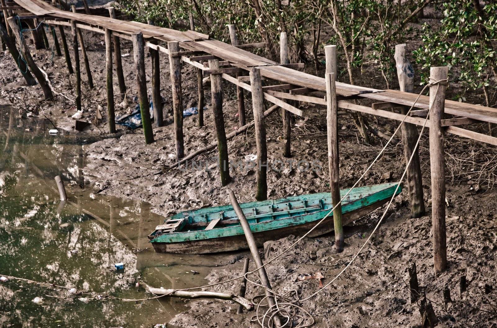 old rowboat in the mud at low tide