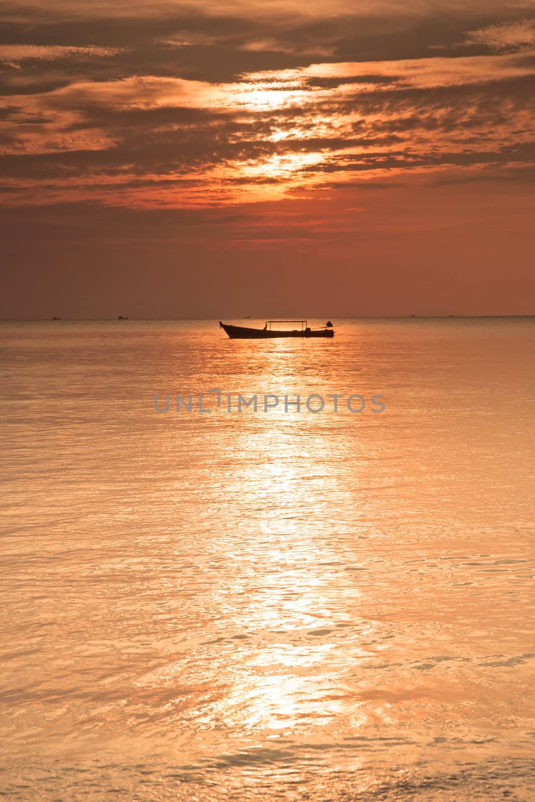 boat on sea at sunset by clearviewstock