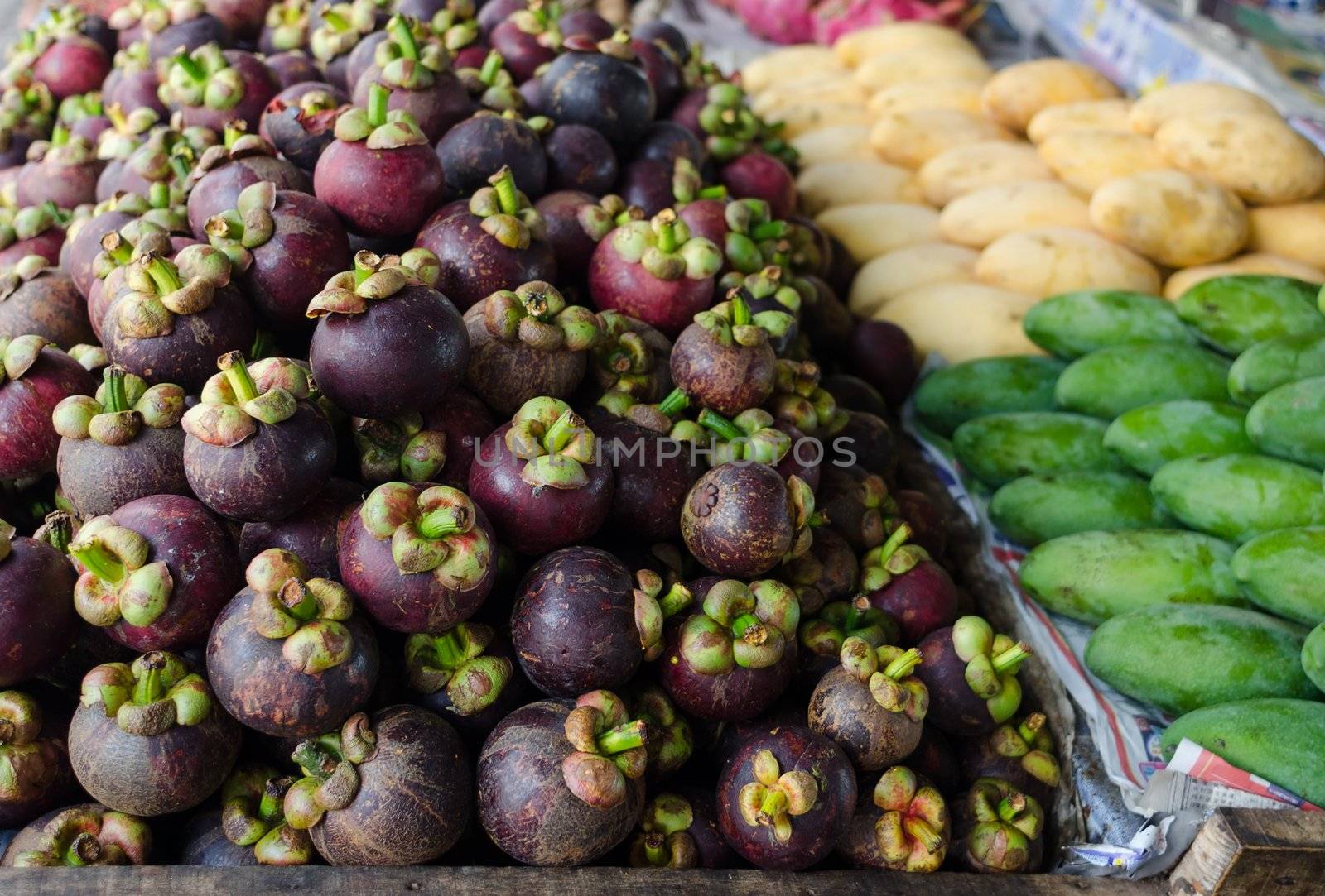 Asian open market with tropical fruits