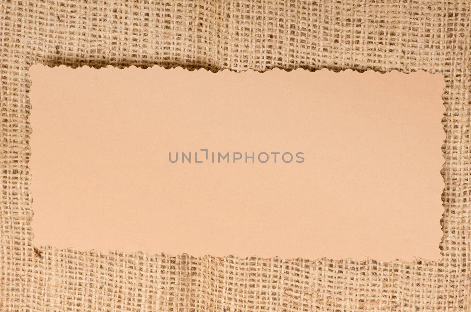 Old paper tag on natural burlap