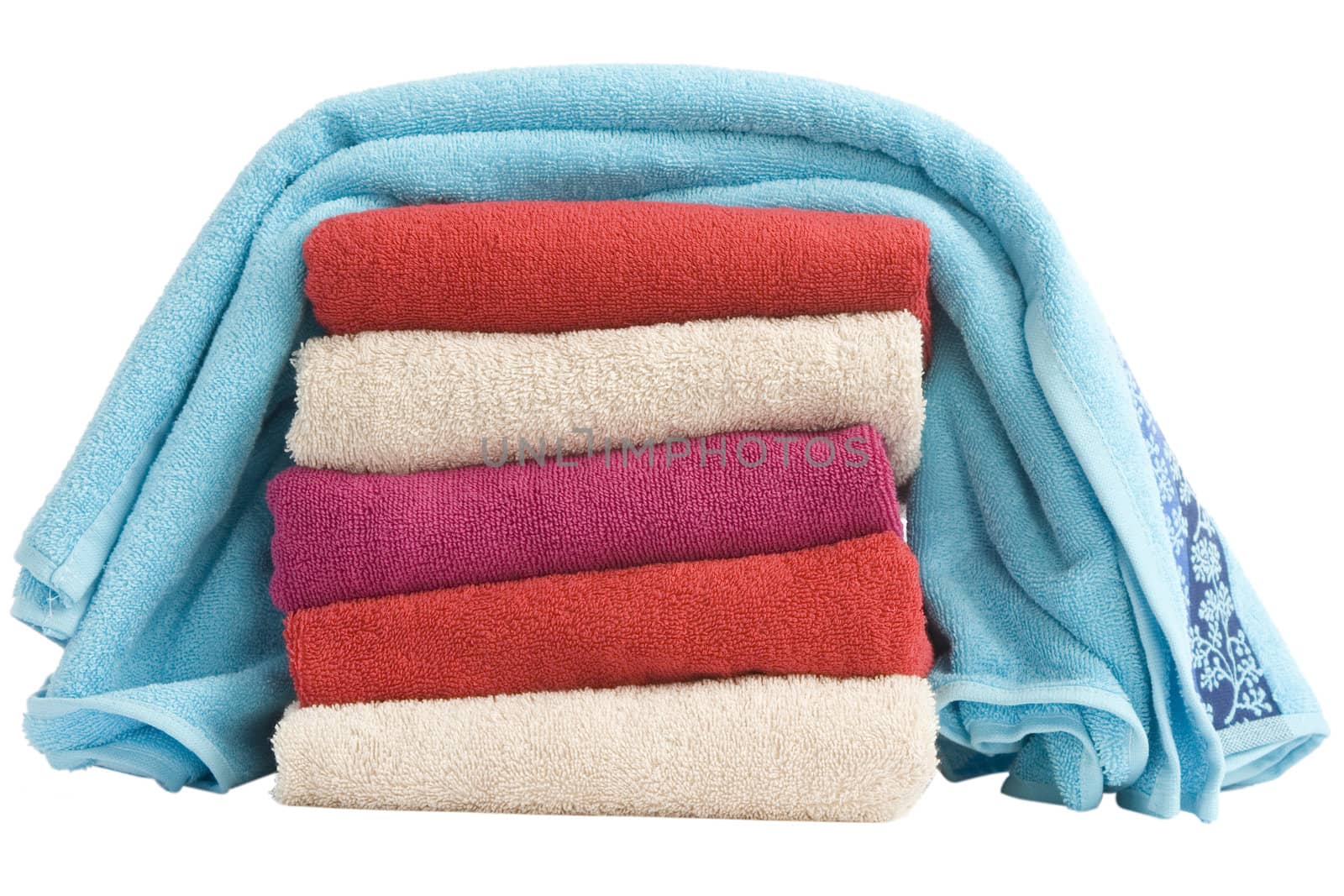 stacked of colorful towels on a white background