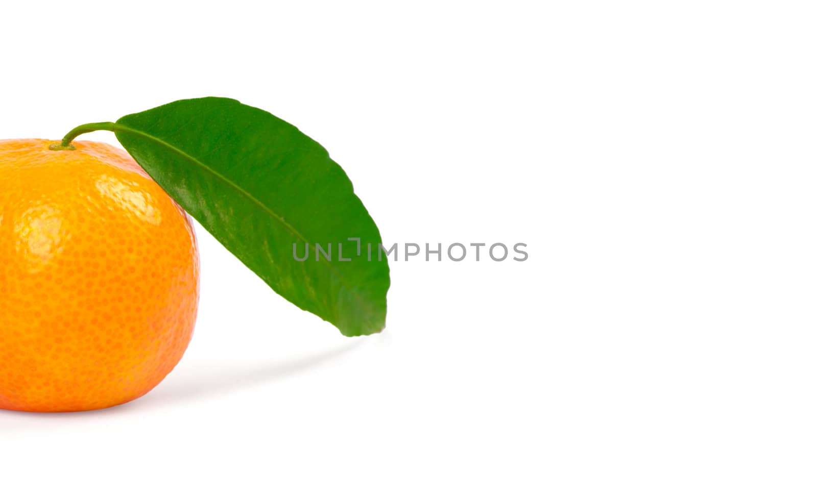 Tangerine with green leaves isolated on white