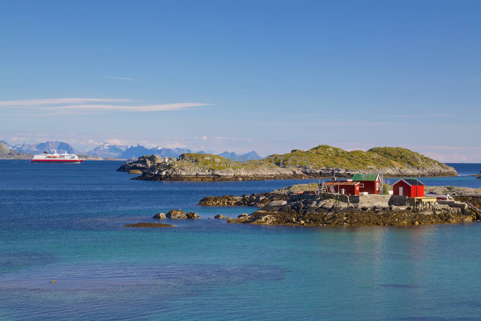 Fishing house on tiny islets on the coast of Lofoten islands in Norway
