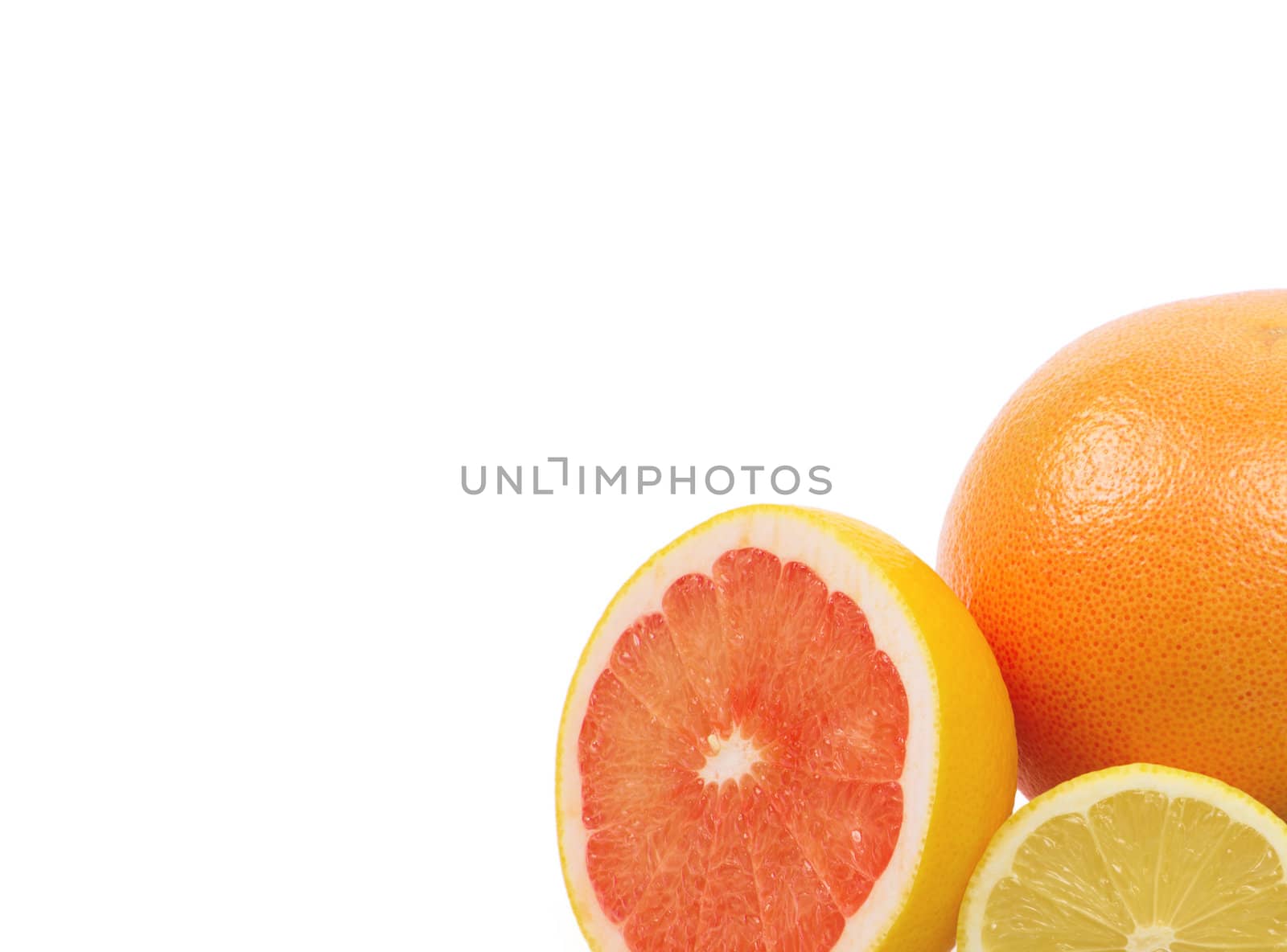 Image of a fresh whole lime, lemon and orange isolated on white