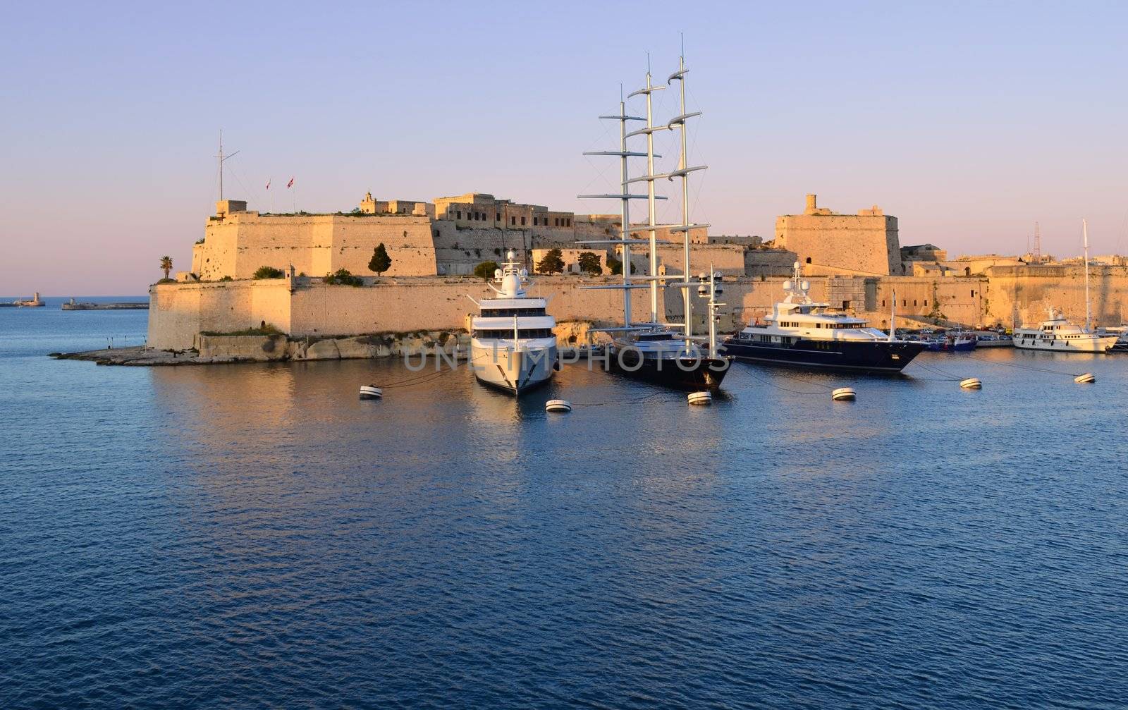 Sunset over the fort St. Angelo in the Grand Harbour of Malta
