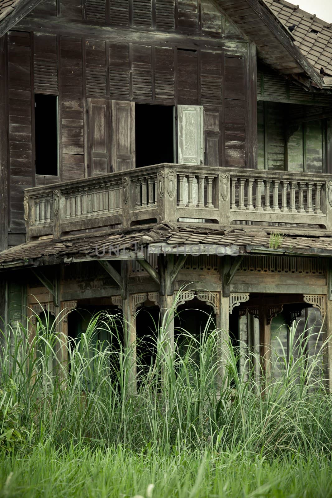 abandoned old house with grass in Thailand