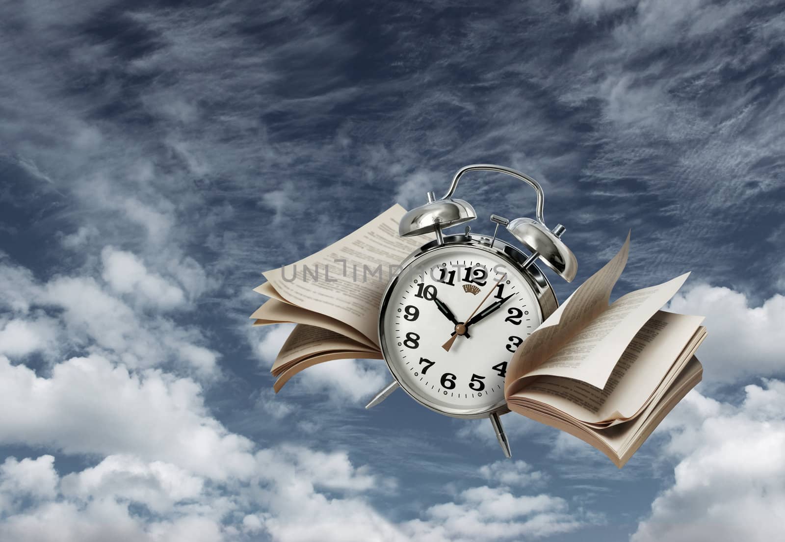 Old alarm clock flying with page wings, time flies concept