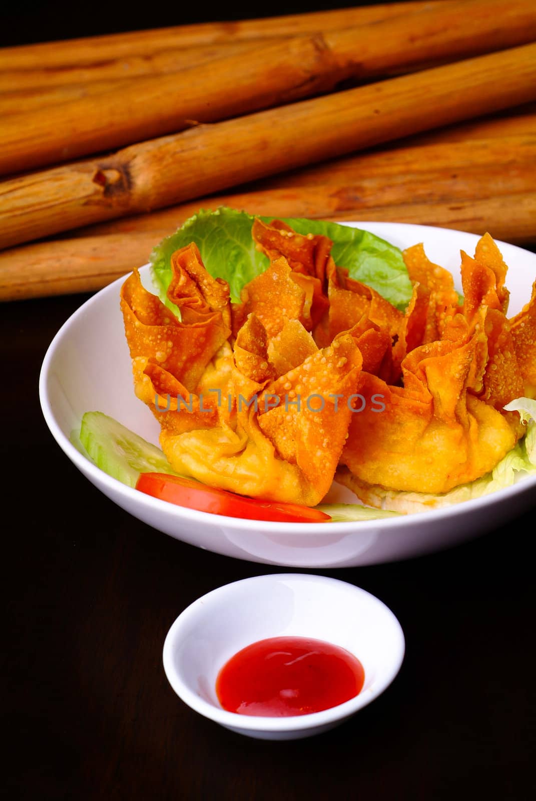 Fried wantons on the background by heinteh