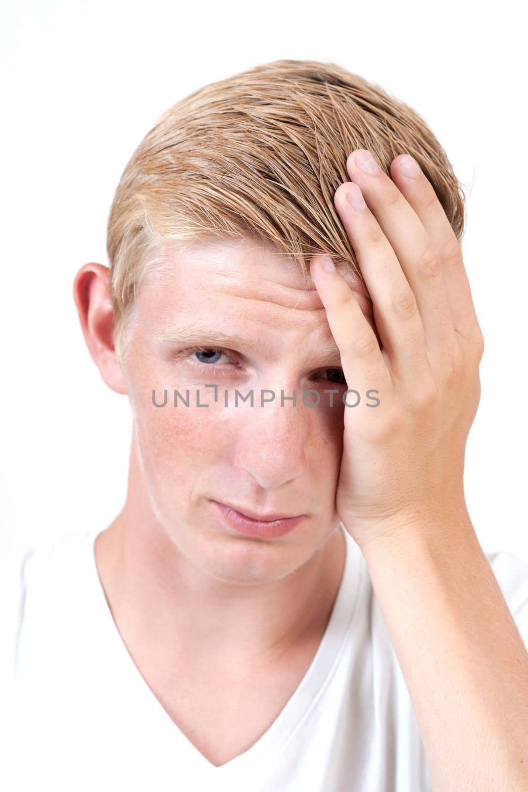 Sad man with hands on head isolated on white 