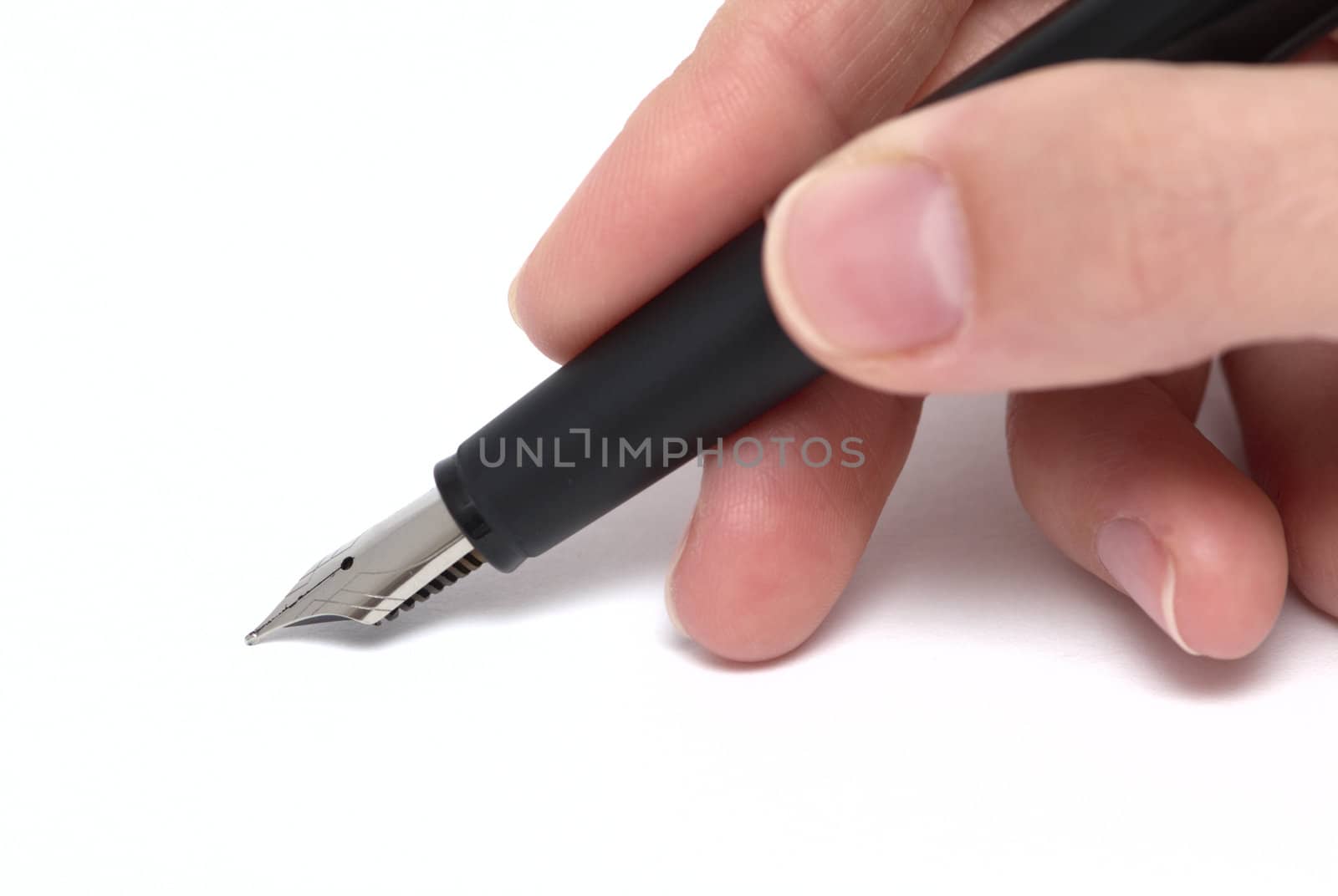 A pen in a hand isolated