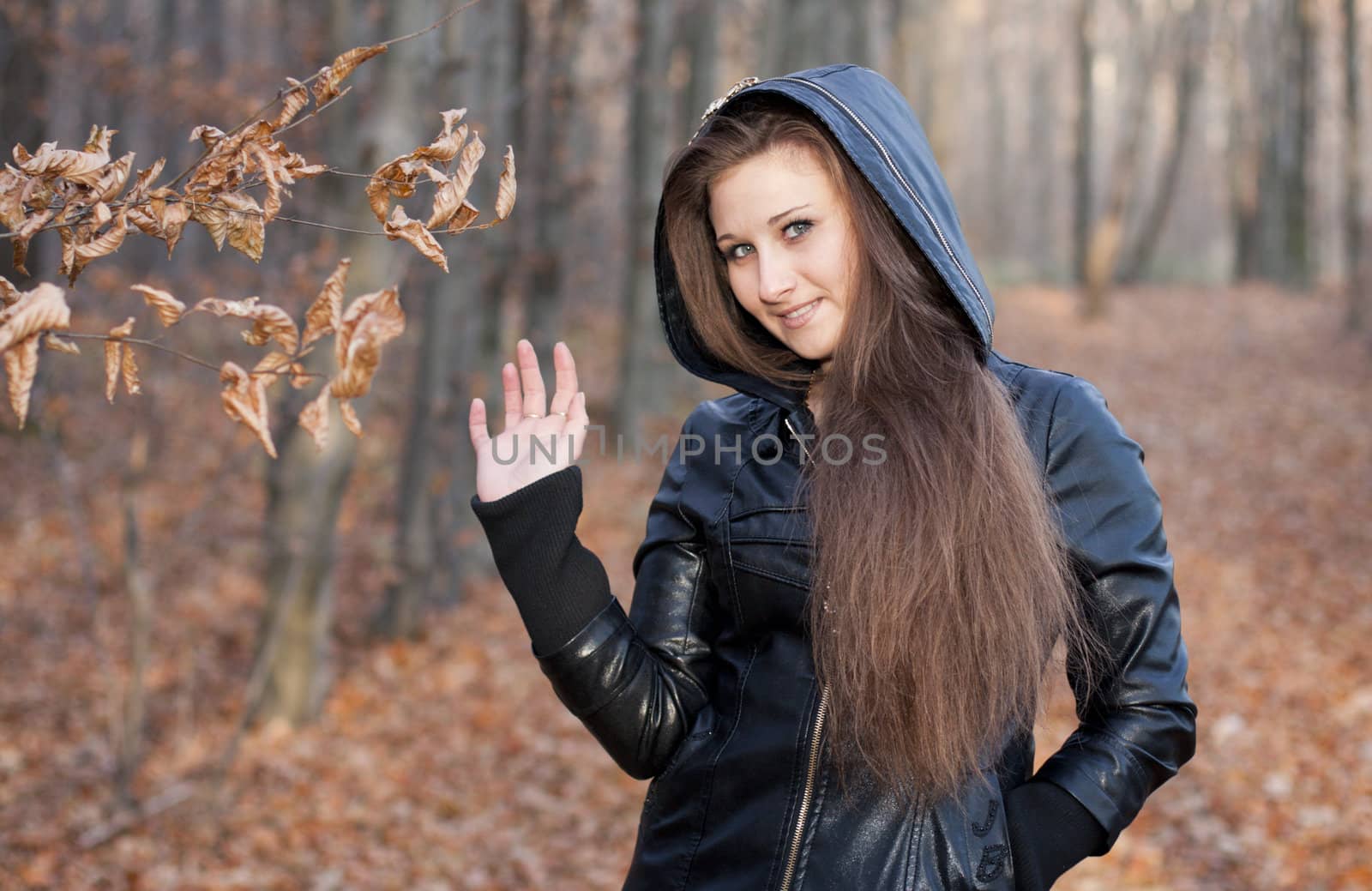 Girl on the background of autumn forest