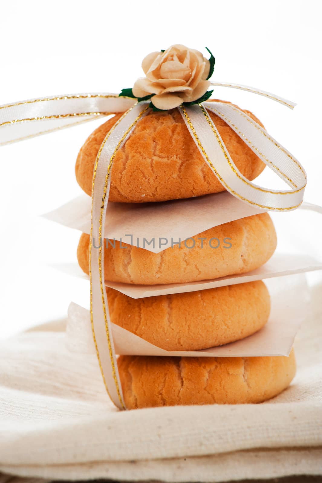 Vanilla cookies as present on napkin and white table