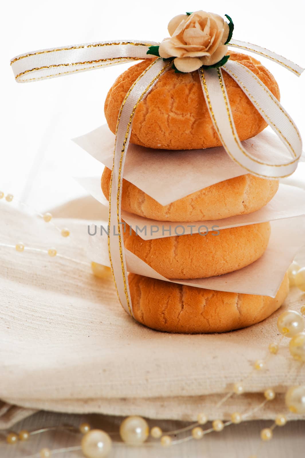 Vanilla cookies as present on napkin and white table