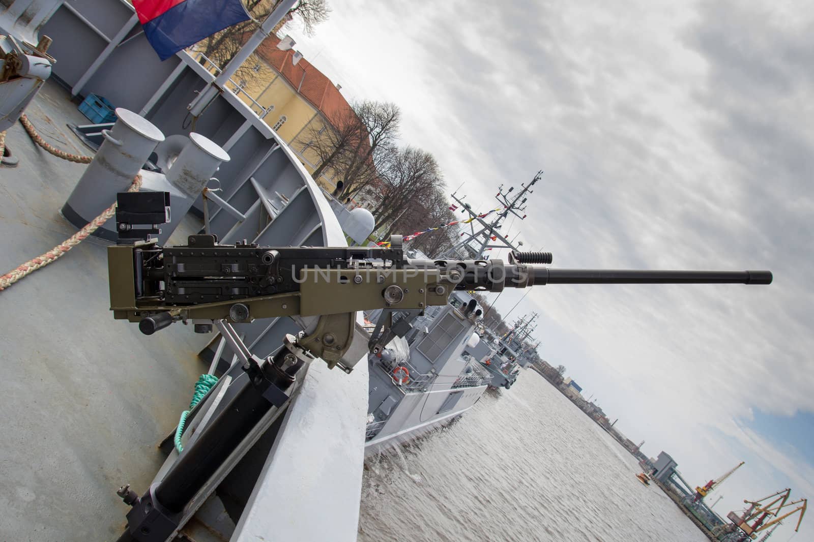 machine gun on warship against dark sky
