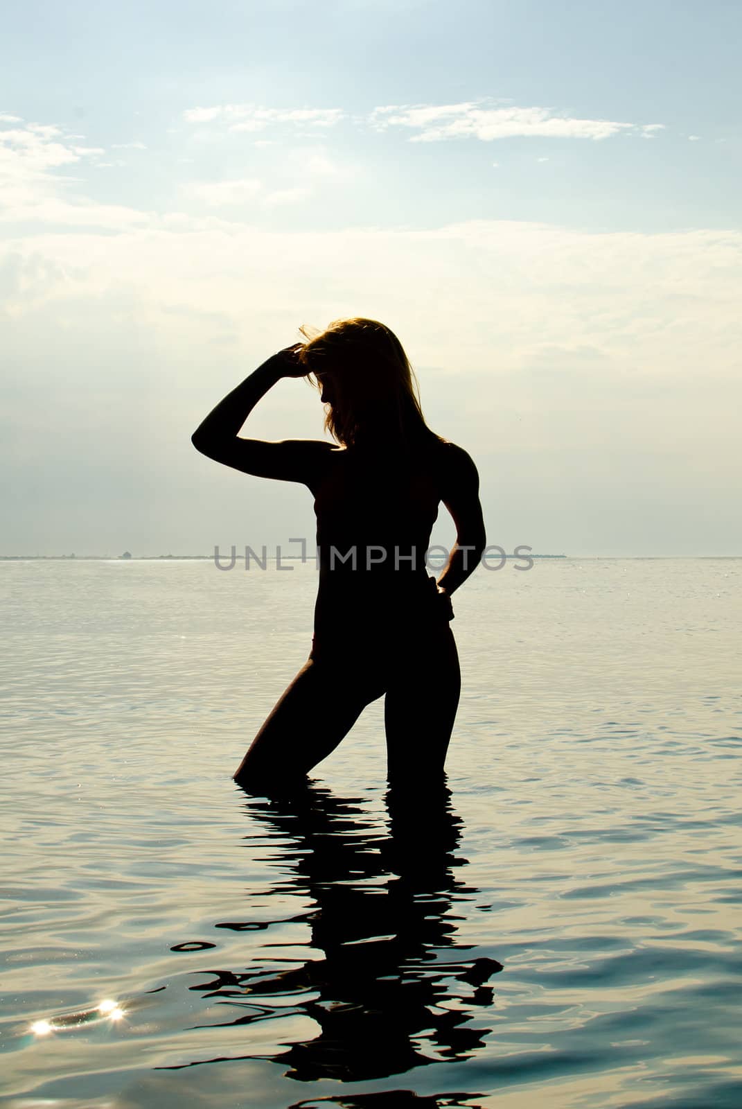 Silhouette of woman in the sea