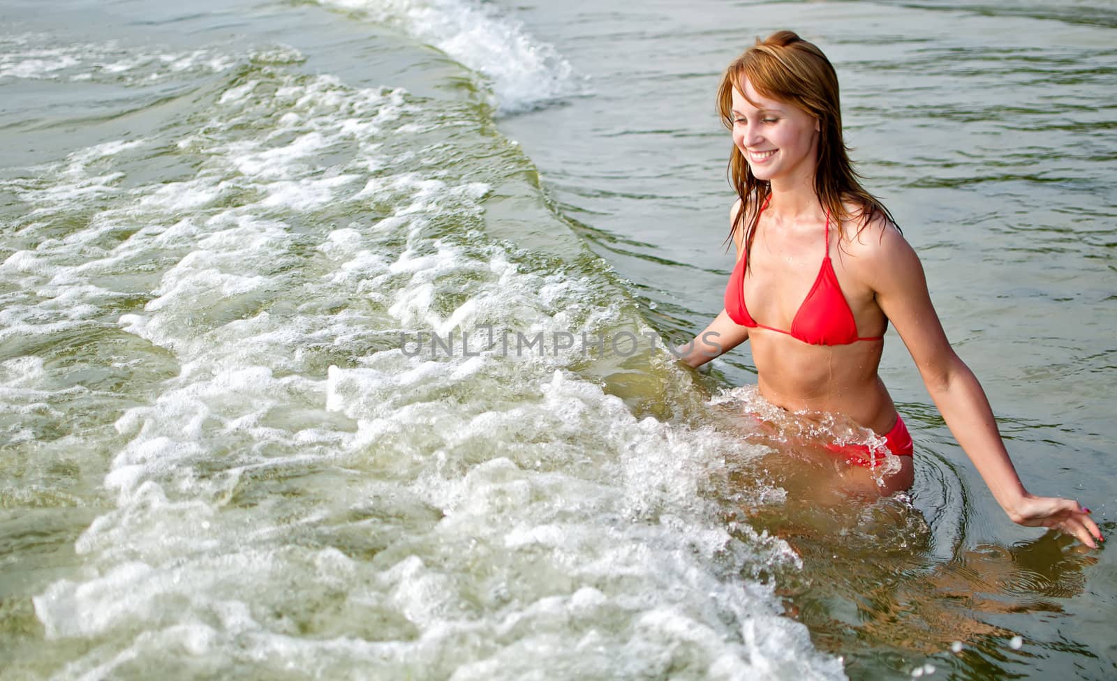 Pretty woman having fun in the sea