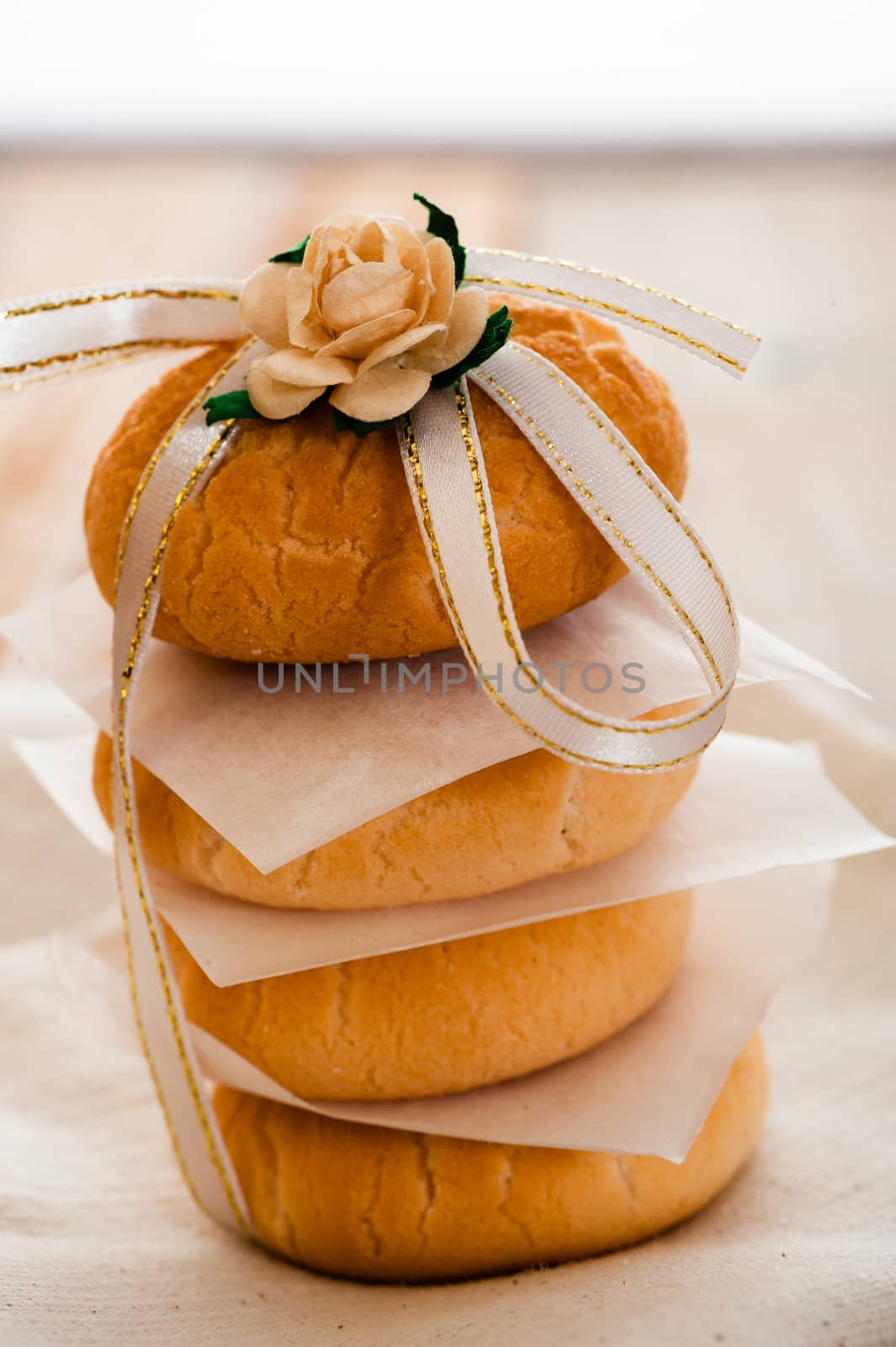 Vanilla cookies as present on napkin and wooden table