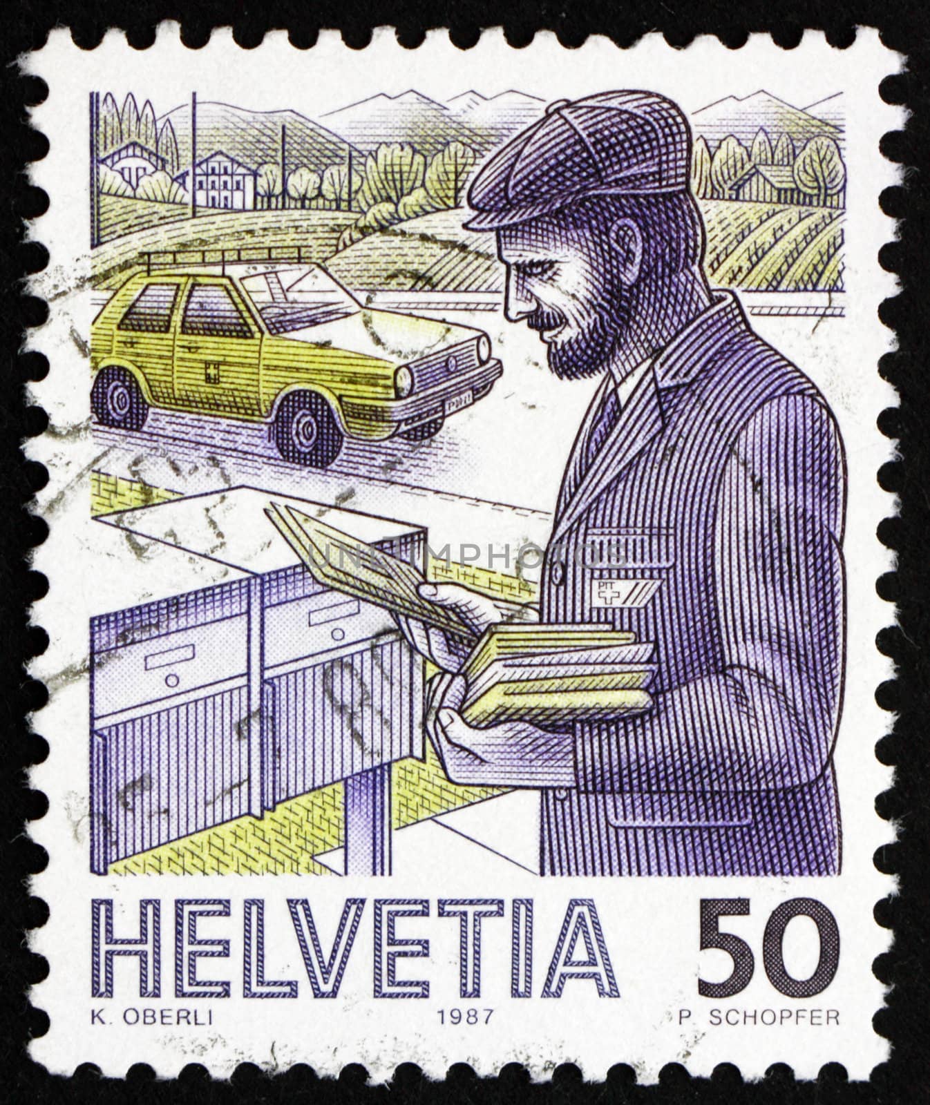 SWITZERLAND - CIRCA 1987: a stamp printed in the Switzerland shows Postman, 1986, Mail Handling, circa 1987
