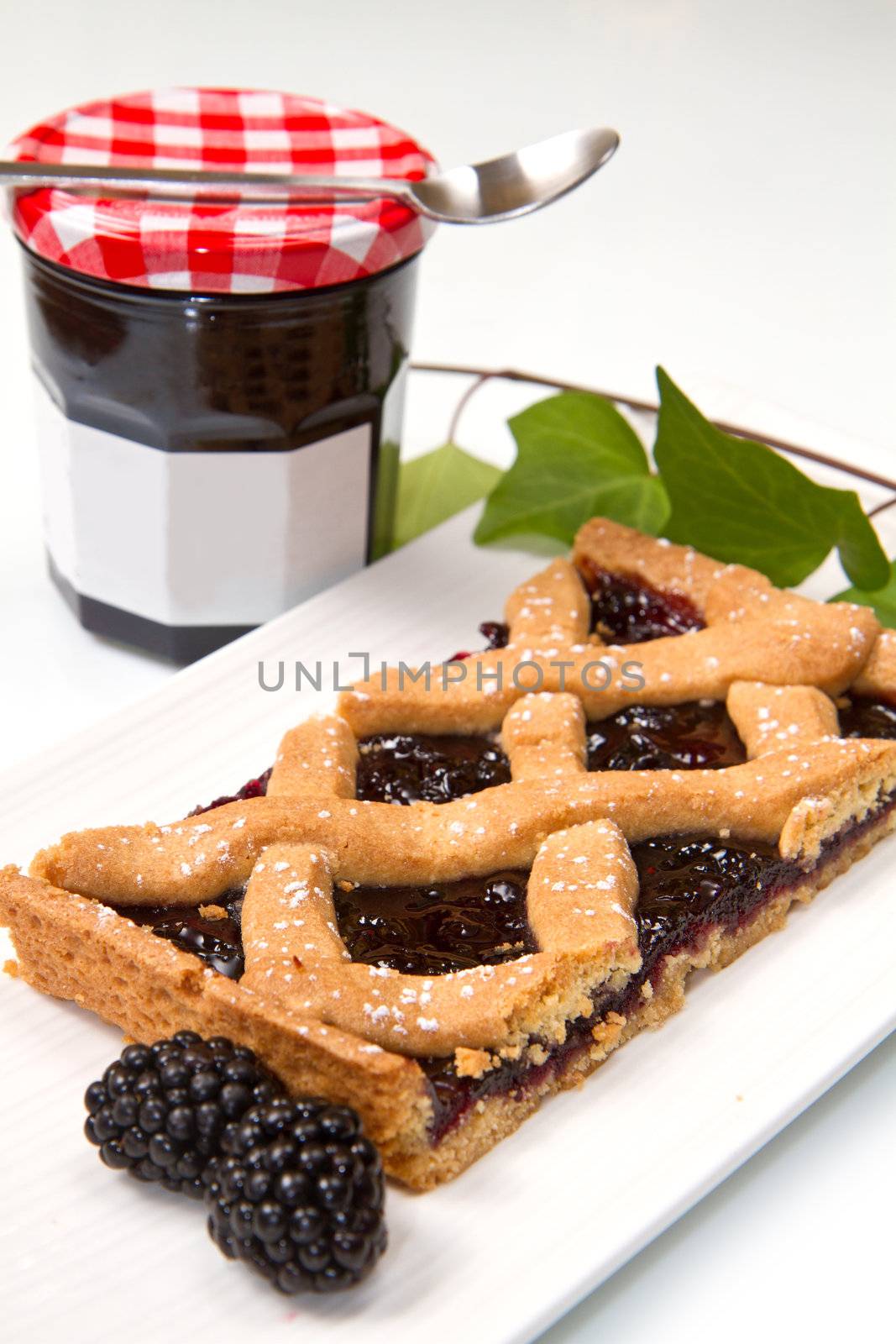 blackberry tarte on white background