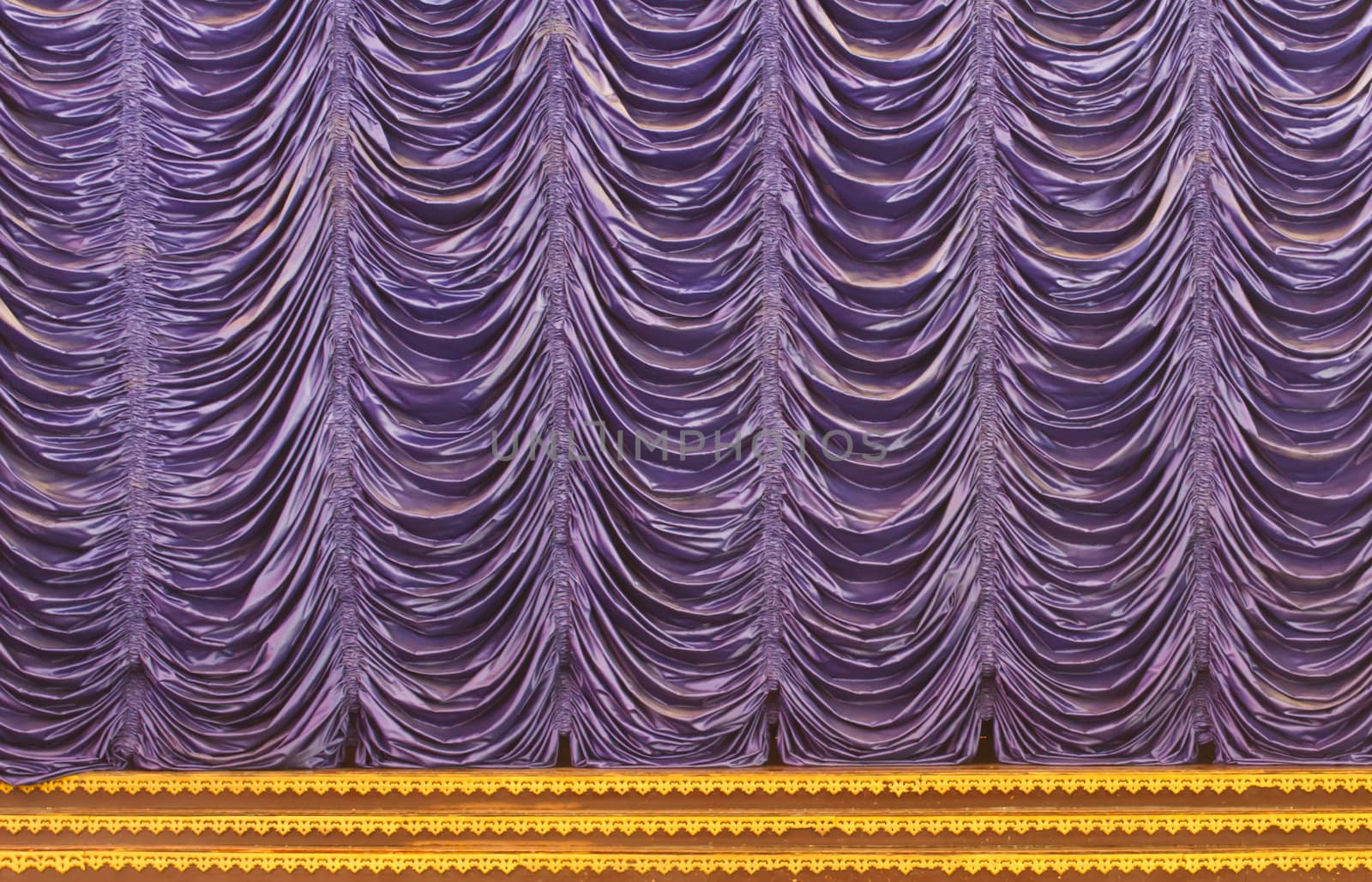 The purple curtains on the stage