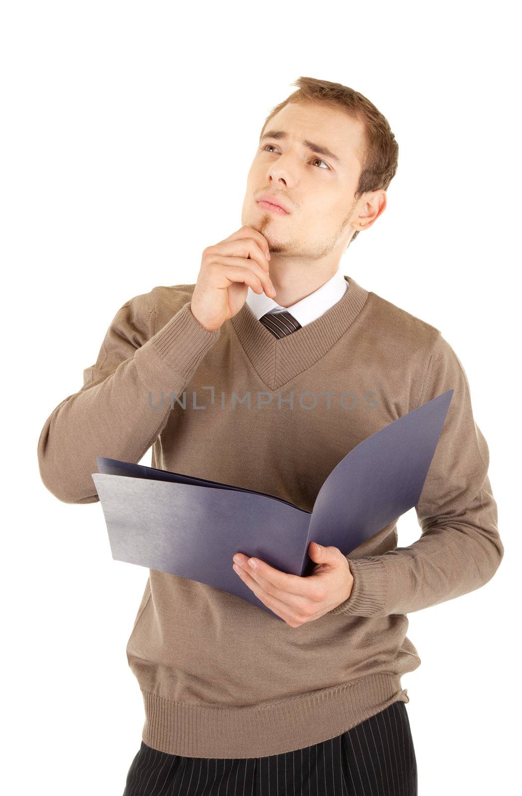 Young well-dressed thinking man in formalwear is holding a open blue file for documents. Isolated on white background.