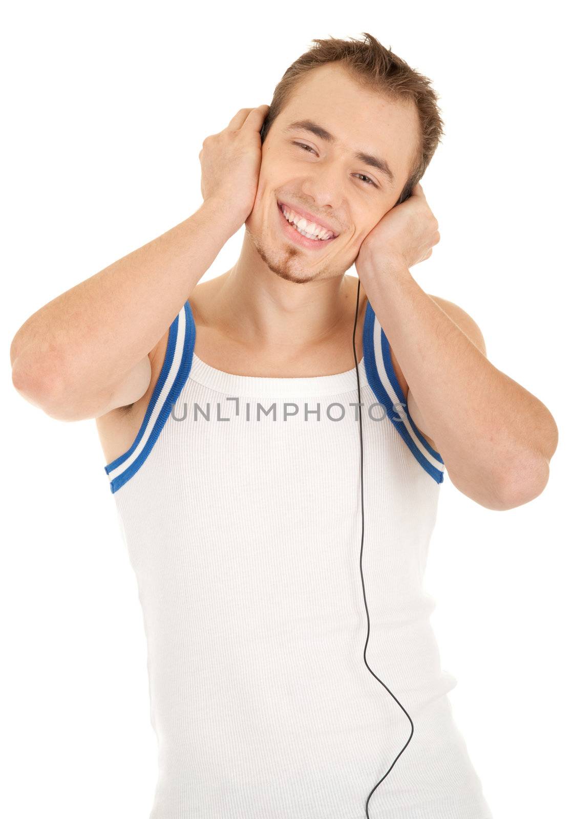 Smiling handsome young man in casual style with headphones is listening music, isolated on white background