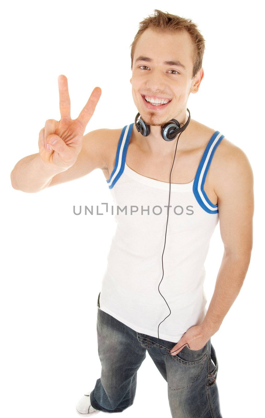 Smiling handsome young man in casual style with headphones shows sign freedom, isolated on white background