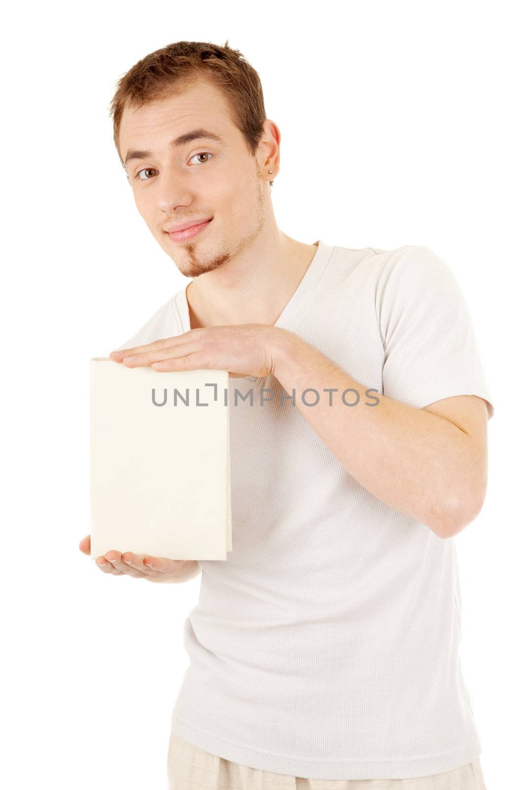 Handsome young man demonstrates a book by two hands. Image include clipping path for the book.