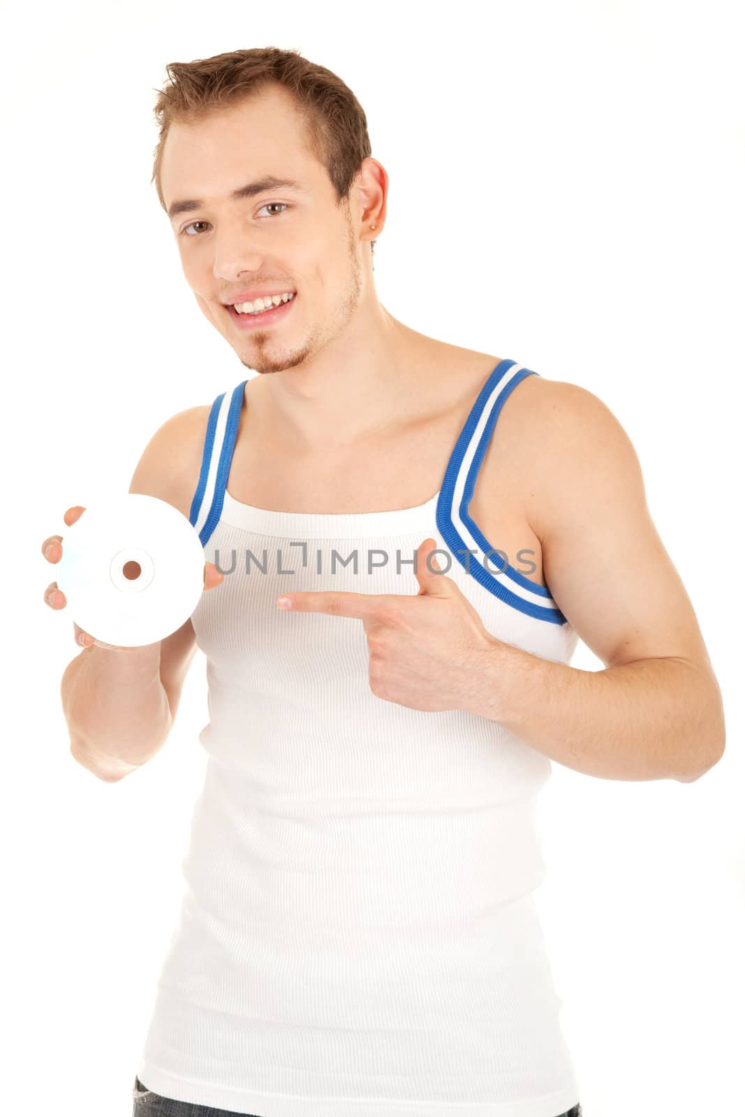 Handsome smiling young man in T-shirt is showing a compact disk. Isolated on white background