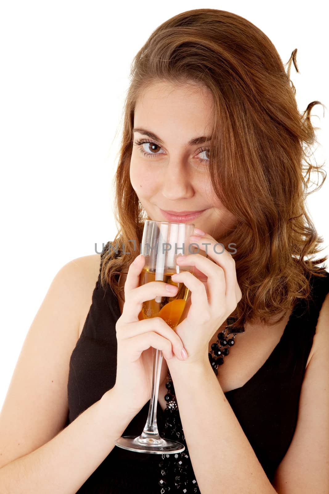 Beautiful woman with a glass with champagne on white background. Focus on woman's eyes.