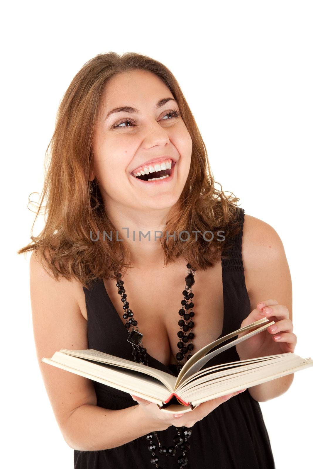 Beautiful women with a book in hands is laughing